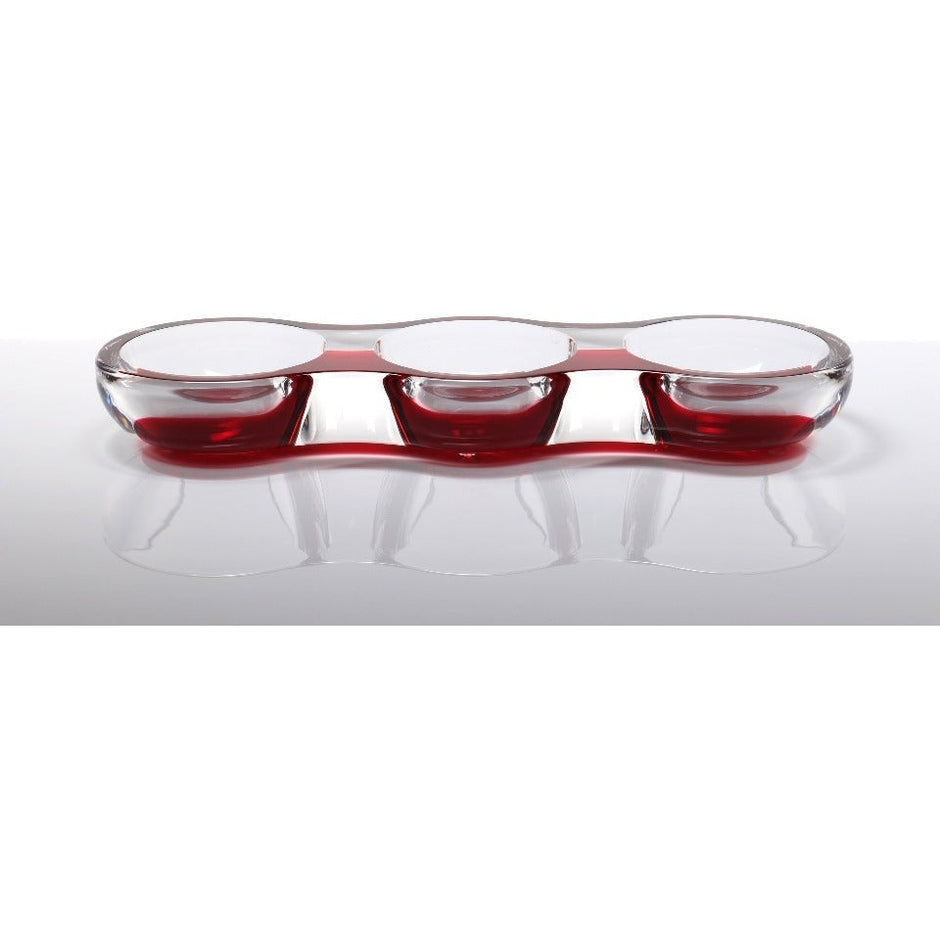 An acrylic tamarin bowl with a ruby red exterior and clear glass basins, designed for serving nuts, candy, or as a decorative centerpiece.