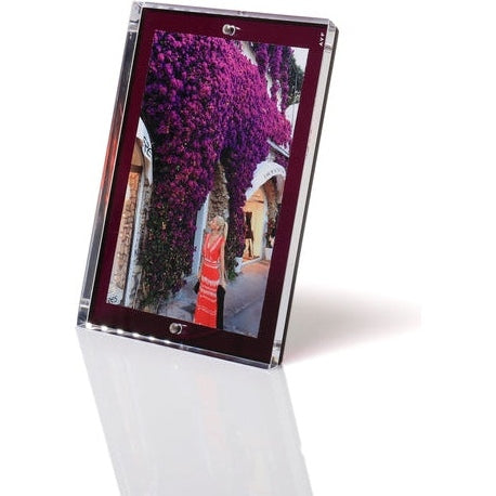 An Alexandra Von Furstenberg acrylic snap frame in purple color displaying a photo, featuring a magnetic design for photo attachment.
