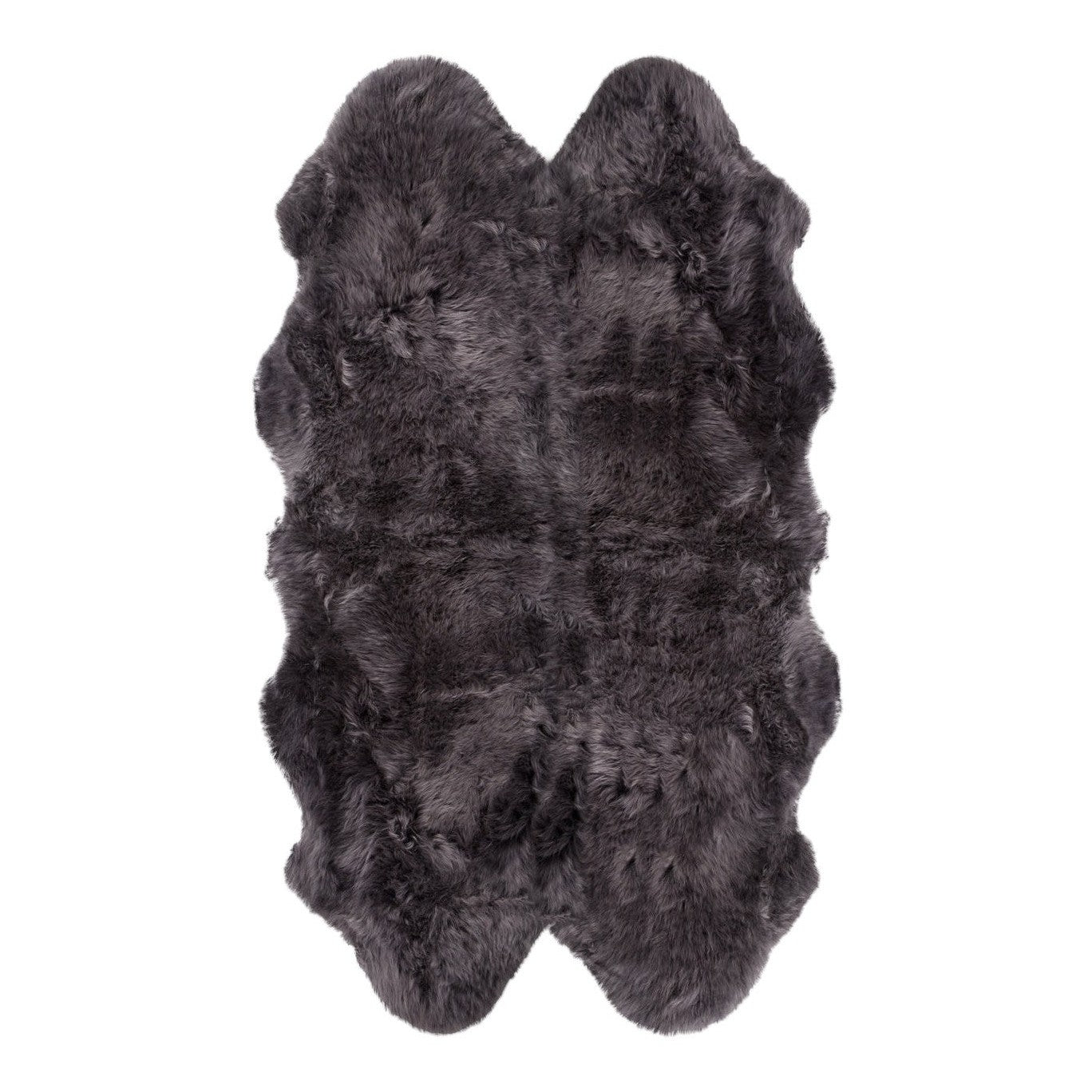 A natural-shaped black sheepskin rug
