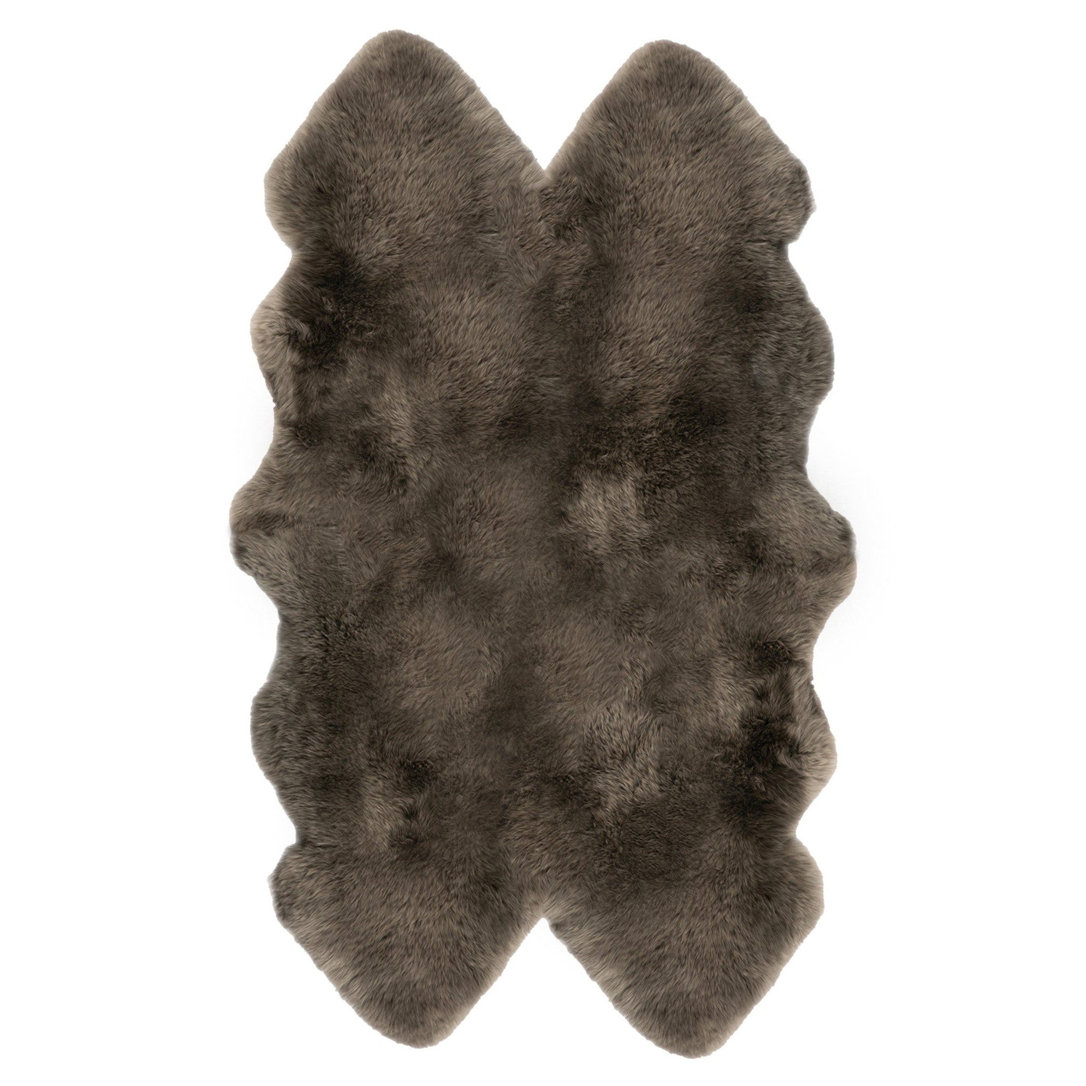 A natural-shaped brown sheepskin rug
