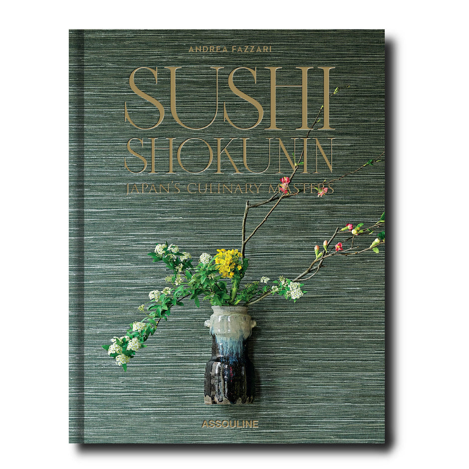 Book titled 'Sushi Shokunin' with floral design on a green textured background