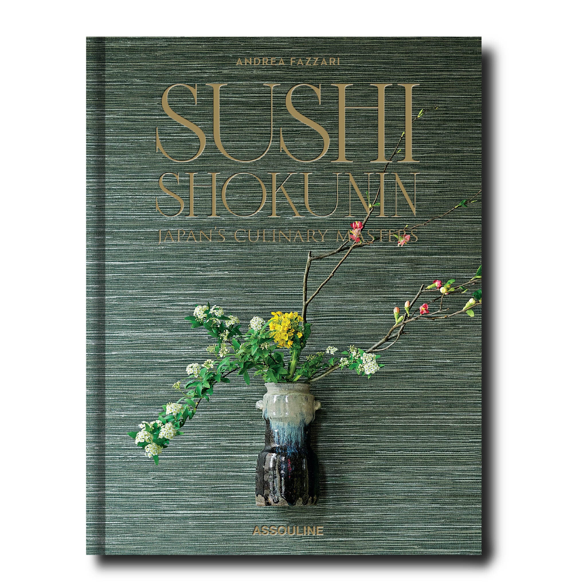 Book titled 'Sushi Shokunin' with floral design on a green textured background