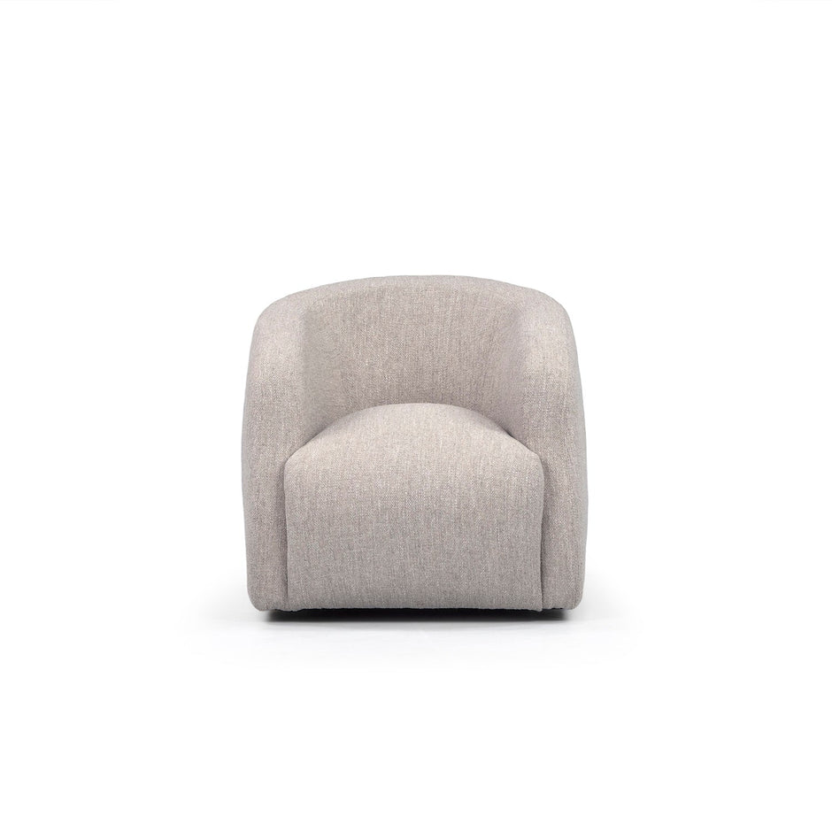 A beige upholstered Theo Club Swivel Chair with a curved backrest and a 22” swivel base, displayed against a white background.