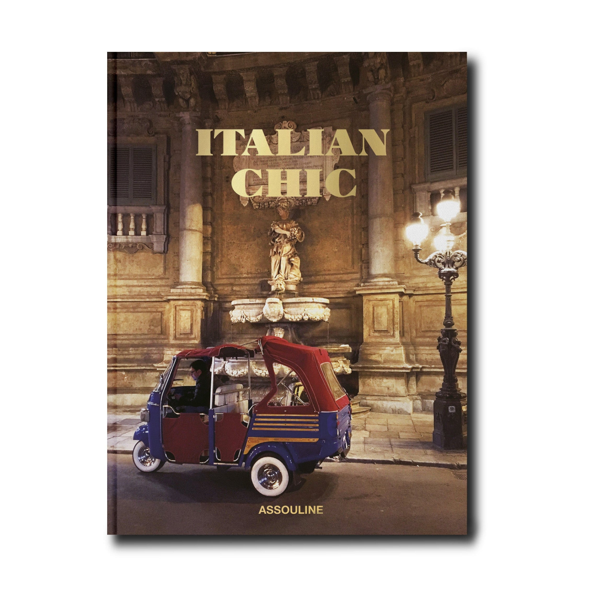 Book cover of 'Italian Chic' by Assouline with a vintage-style tuk-tuk and classical building in the background.
