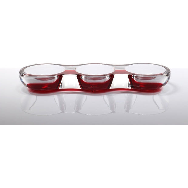 An acrylic tamarin bowl with a ruby red exterior and clear glass basins, designed for serving nuts, candy, or as a decorative centerpiece.