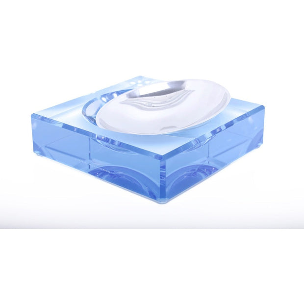 A white aluminum bowl liner fitted into a blue acrylic candy bowl, designed to protect the bowl from scratches.