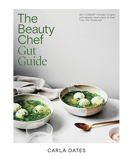 Book cover of 'The Beauty Chef Gut Guide' with two bowls of soup on a table.