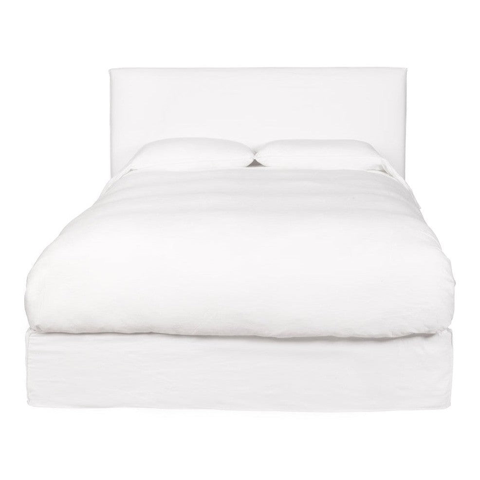 A king-sized white leather bed frame with a headboard and footboard, presented in an unmade state showcasing the mattress and pillows.