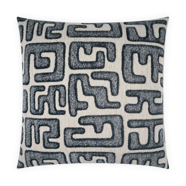 A square-shaped decorative pillow with a geometric pattern in navy blue on a natural beige background.