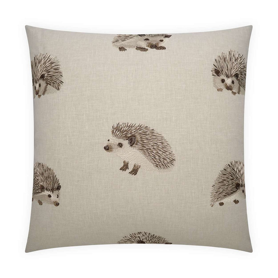 A square-shaped throw pillow with a beige background featuring a pattern of hedgehog designs.