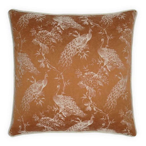 A square-shaped throw pillow with a copper color and a white floral and bird pattern.