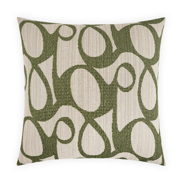 Decorative pillow with a green abstract pattern on a beige background