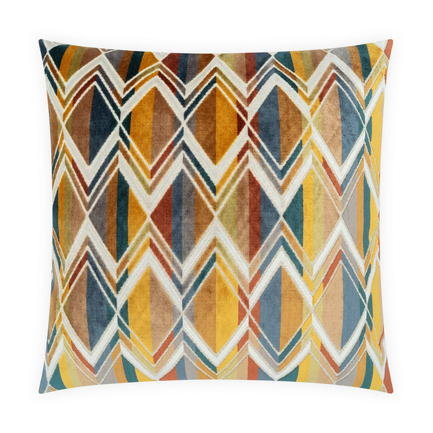 A square throw pillow featuring a colorful geometric chevron and diamond pattern in mustard yellow, orange, teal, blue, and cream on a white background.