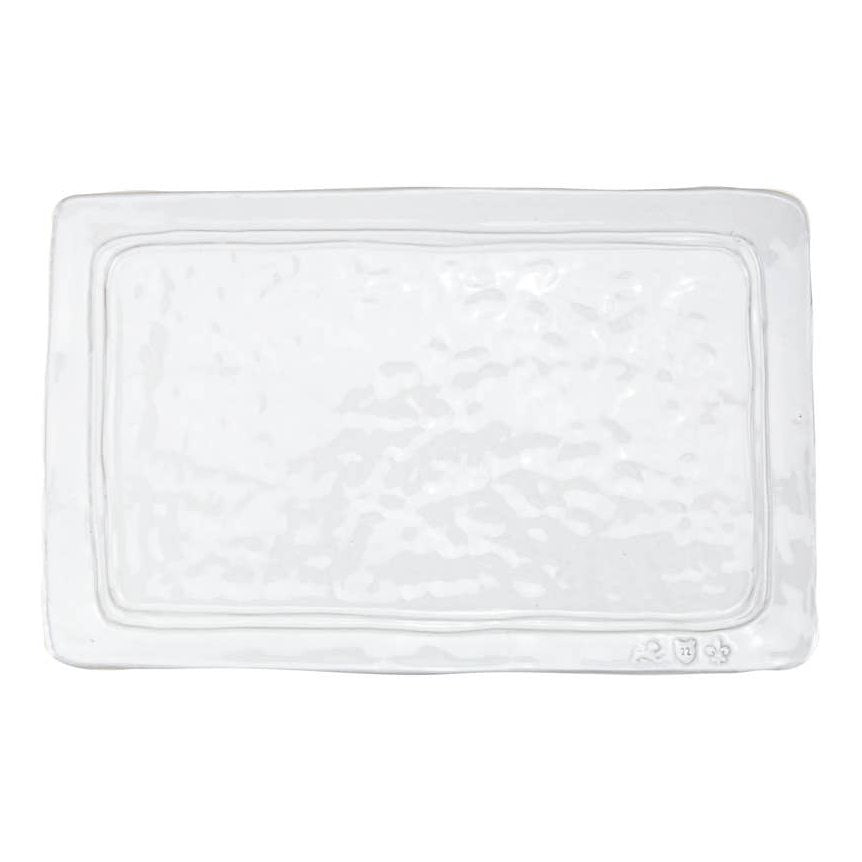 A white rectangular ceramic platter with a textured surface.