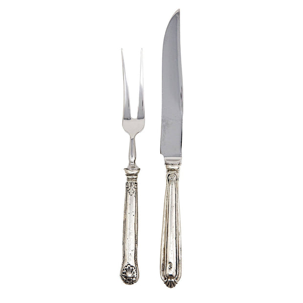 A carving fork and knife with ornate handles, made of Italian pewter and stainless steel.