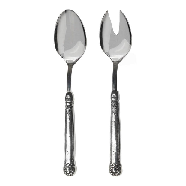 A pair of silver salad servers, with one fork and one spoon, featuring ornate handles.