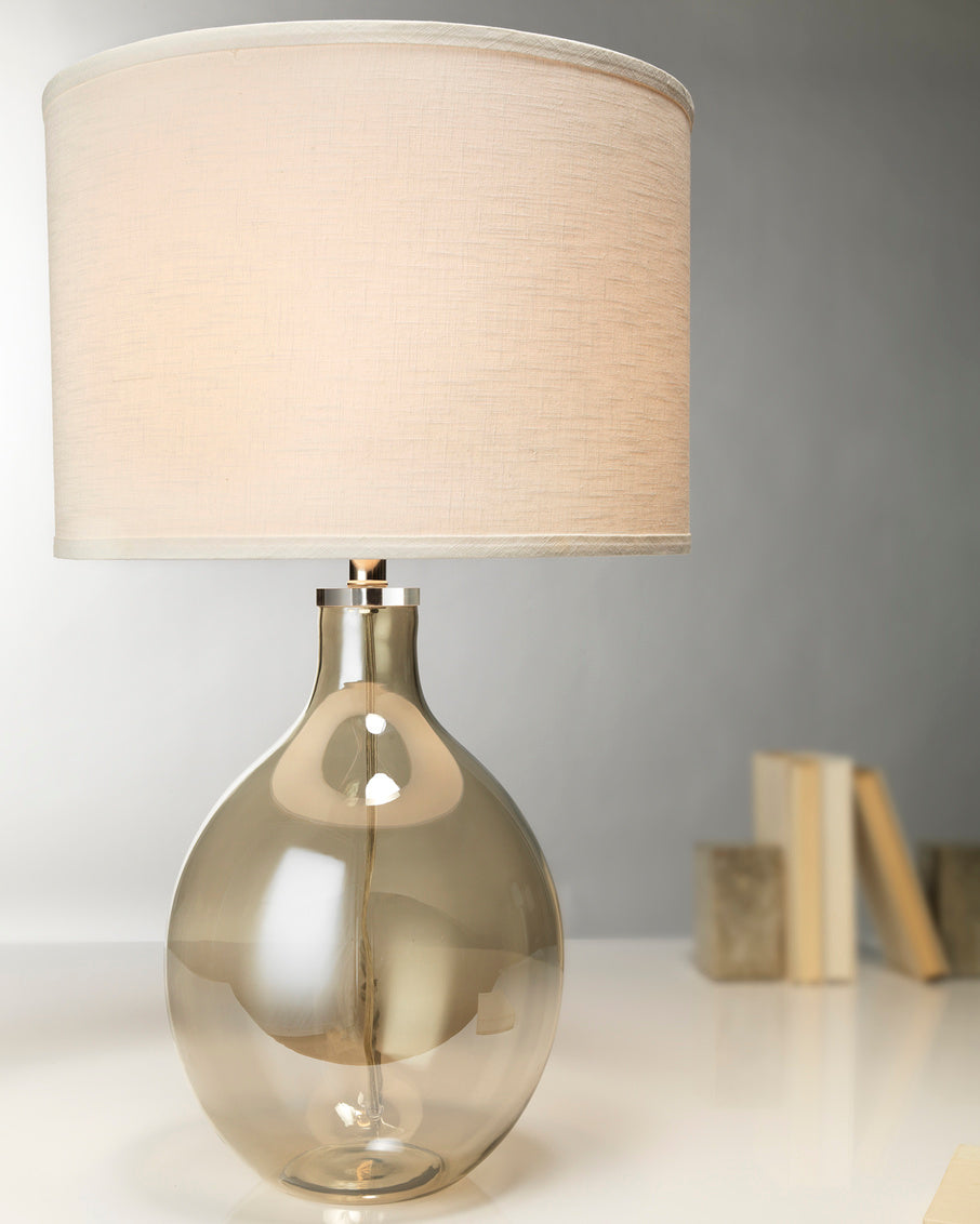 Taupe clear glass table lamp with a beige shade 