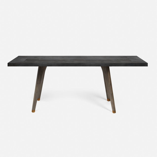 A rectangular dining table with a dark stained oak base and a zinc tabletop.