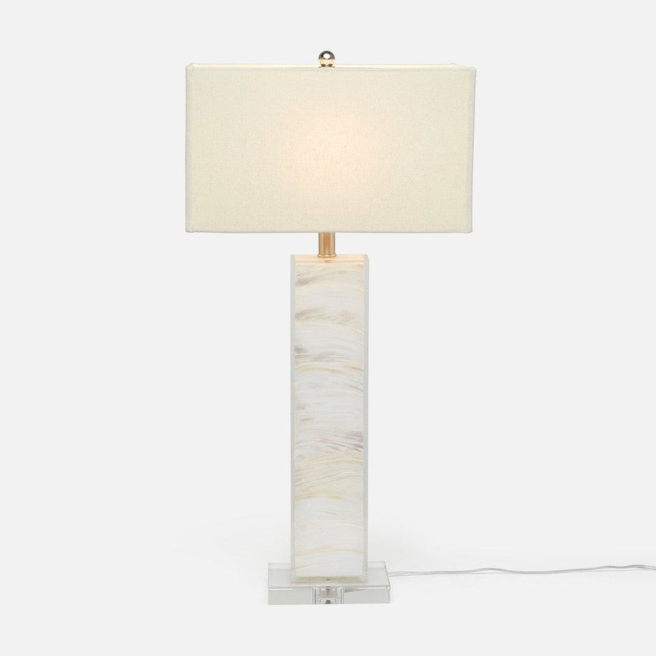 A tall, rectangular, white table lamp with a light mother-of-pearl finish and a natural linen shade.