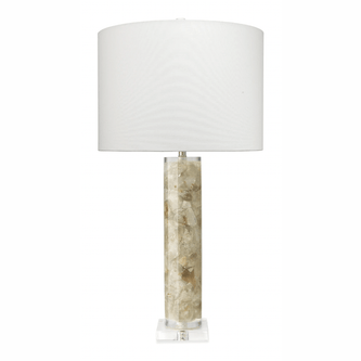 A table lamp with a natural calcite base and a white linen drum shade.