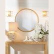 A round gold leaf finish mirror 