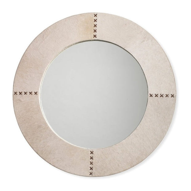 A round mirror with a white hide frame and chocolate leather accents, featuring a cross stitch pattern.