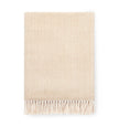 Beige woven blanket with fringes on a white background