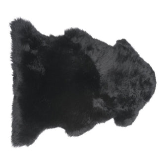 A single longwool black sheepskin rug.