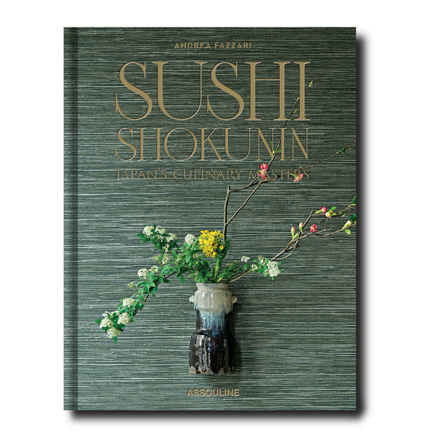 Book titled 'Sushi Shokunin' with floral design on a green textured background