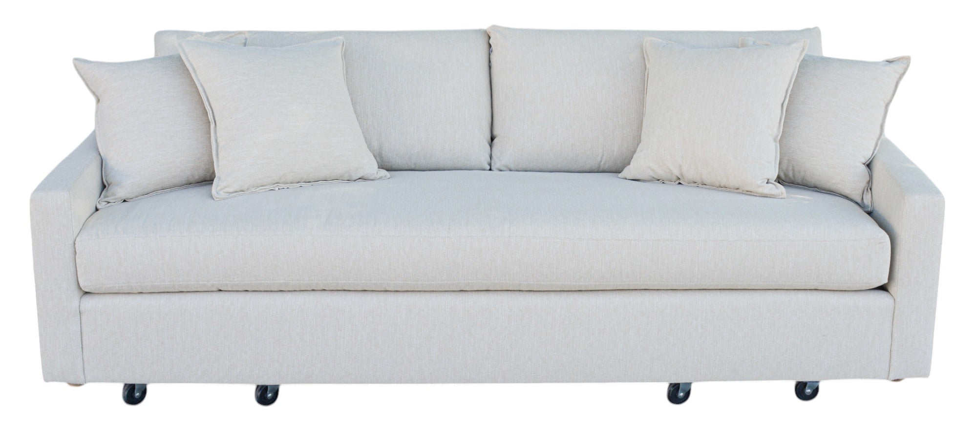 A 'Verellen Thibaut Sofa Amelia Bisque' with beige upholstery, featuring slightly tapered arms, low tight seat, and plush back cushions, on caster wheels.