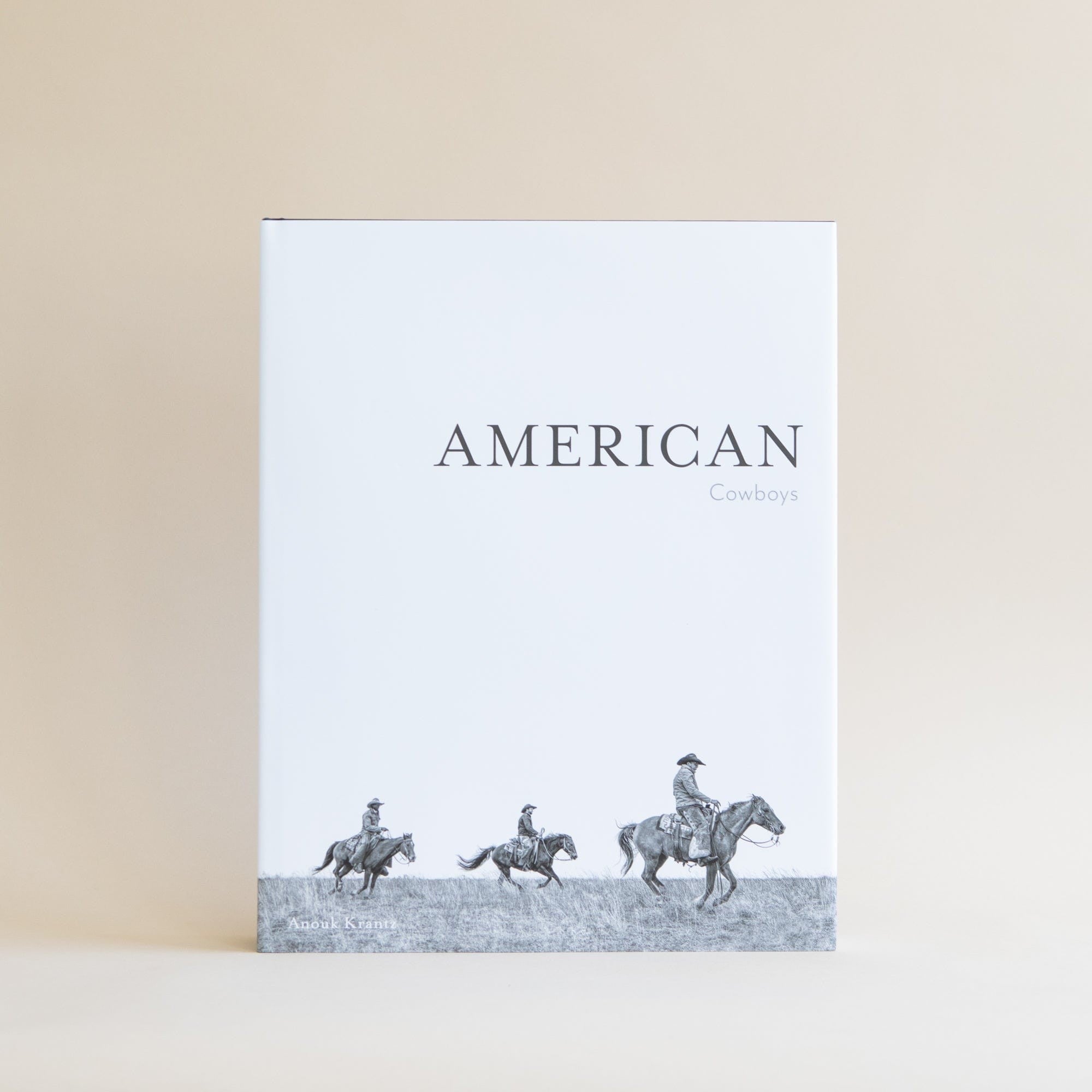 American Cowboys decor book by ACC Publishing featuring vintage cowboy illustrations and Western-themed artwork.