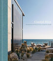 Open pages of the Coastal Bliss decor book by ACC Publishing showcasing stunning beach houses from around the world.