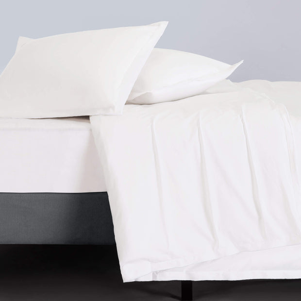 Set of two Adelene Kinfolk King shams in bleached white linen with subtle texture, designed for a cozy and elegant bedroom look.