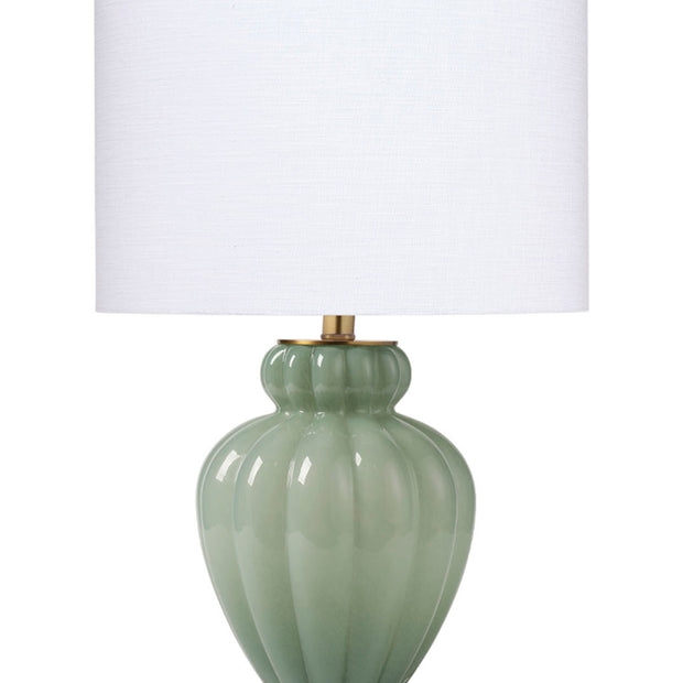 A table lamp with a green gourd-shaped base and a white conical shade, featuring brass hardware and a crystal-clear acrylic finial.