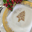 White, green, and red Holly Tree tri-fold napkin from Arte Italica and Crown Linen Designs, featuring festive holiday table linens.