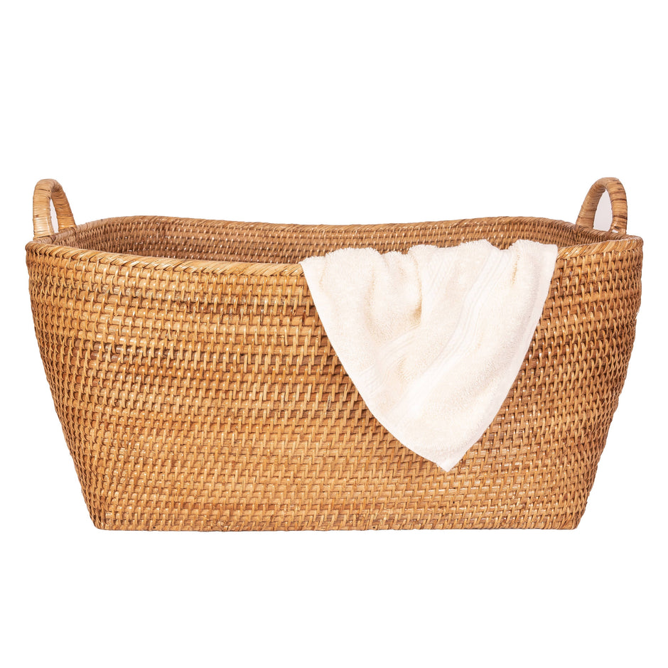 Honey brown rattan everything basket with hoop handles, crafted by Artifacts Trading Company for versatile storage.