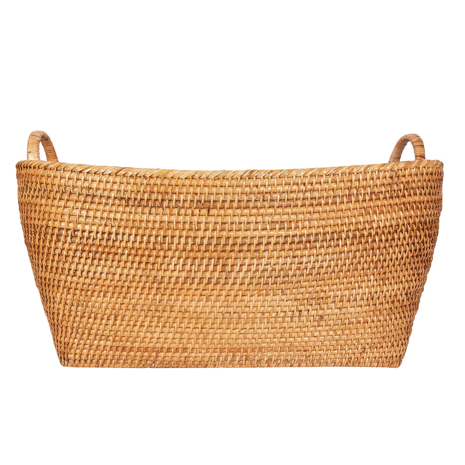 Honey brown rattan everything basket with hoop handles by Artifacts Trading Company, featuring a sturdy woven design and rounded shape.