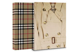 Assouline Burberry decor book featuring iconic fashion and design images, displayed on a clean, elegant surface.