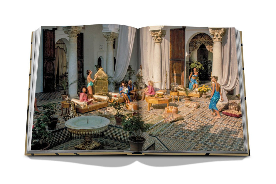 Assouline James Bond Destinations decor book featuring scenic locations and travel inspiration, displayed on a shelf.