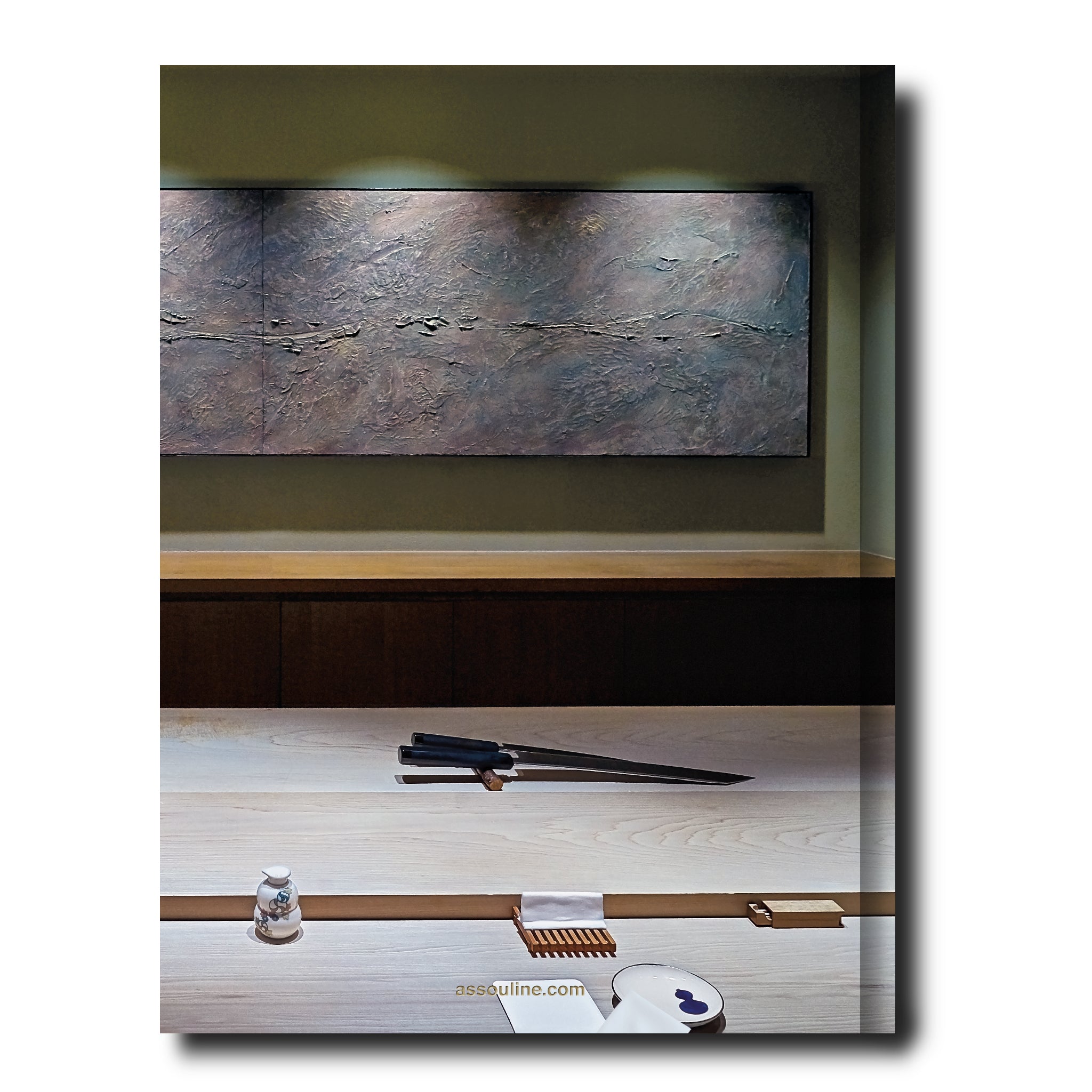 Assouline Sushi Shokunin decor book featuring elegant cover design and Japanese-inspired artwork on the front.