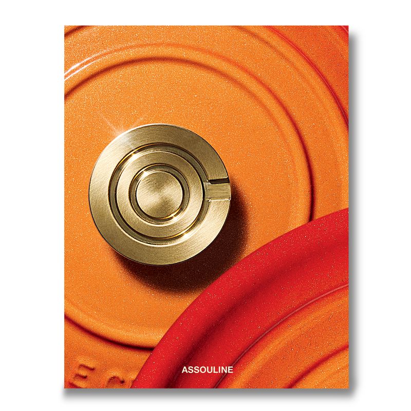 Assouline Le Creuset decor book featuring images of colorful Le Creuset cookware and kitchen design ideas.