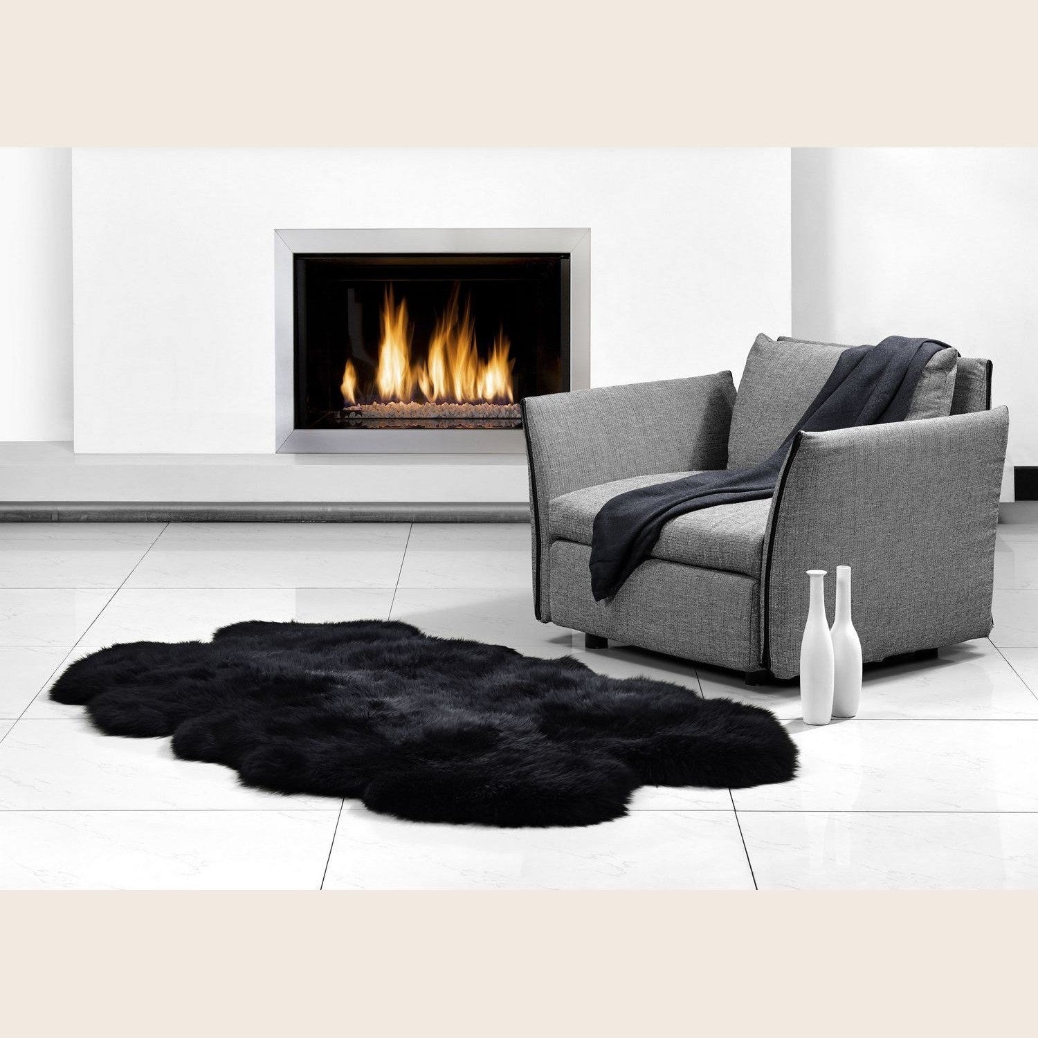 Blackberry Quarto Longwool Sheepskin Rug by Auskin, showing soft, plush black sheepskin with natural wool fibers and textured surface.