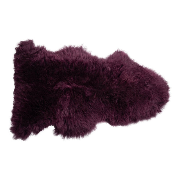 Dark orchid Auskin single longwool sheepskin with soft, plush texture and natural wool fibers, ideal for comfort and decor.