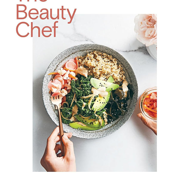 Book cover of 'The Beauty Chef' by Carla Oates with a bowl of salad and a hand holding a spoon.