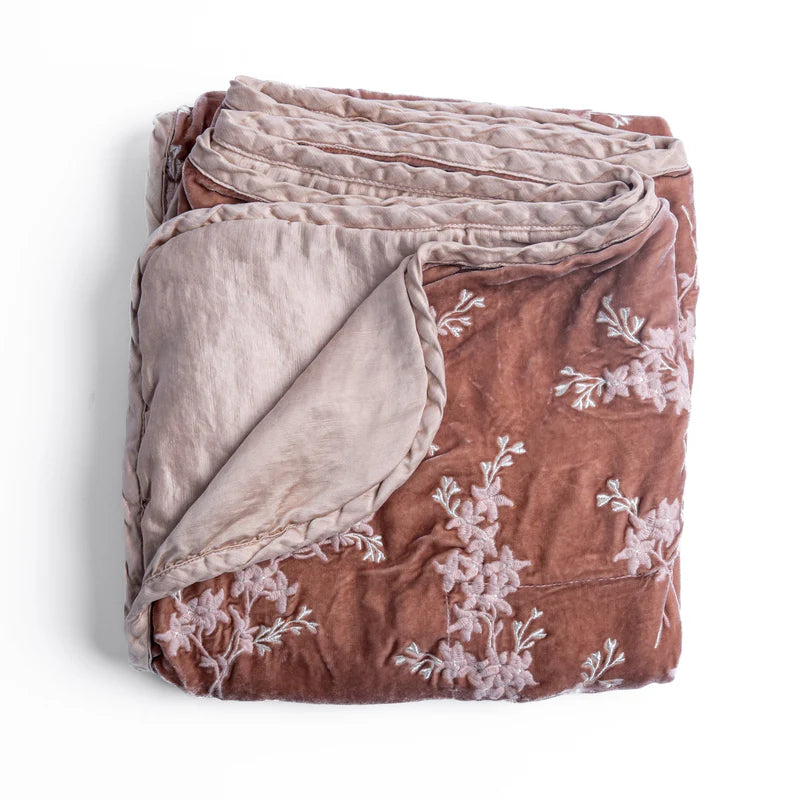 Bella Notte Lynette Throw Blanket in Tahoe Blue, soft and cozy with a luxurious fabric, perfect for adding warmth and style to a sofa.