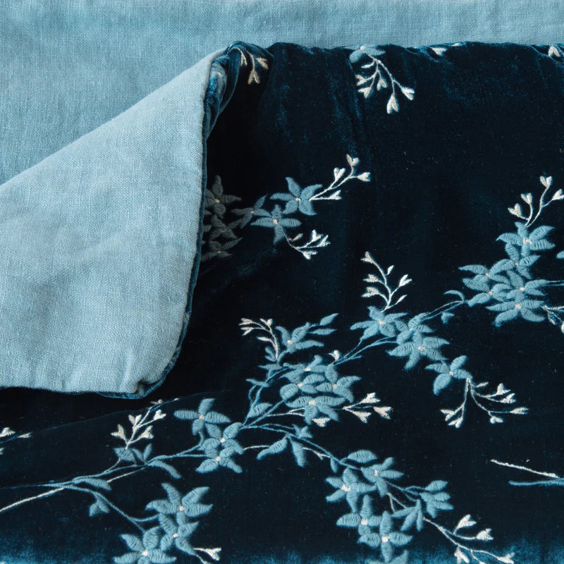 Bella Notte Lynette throw blanket in Tahoe Blue, showcasing soft, luxurious fabric and elegant drape.