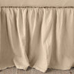 Bella Notte linen bed panel with a twin-sized bed skirt featuring a soft, elegant autumn-colored fabric and tailored design.