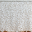 Bella Notte Allora bed skirt in Cenote Cal fabric, elegant bed skirt draping beautifully on an Eastern King bed.