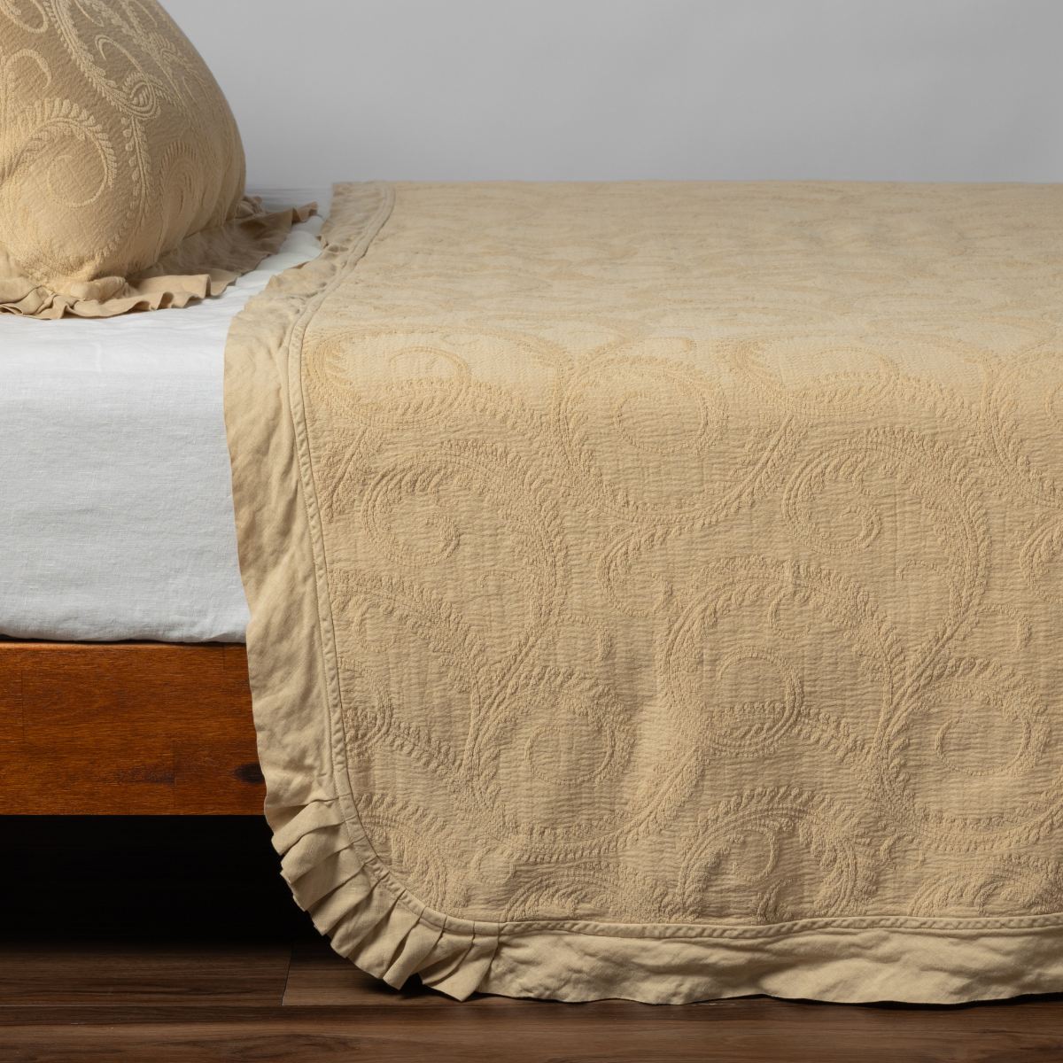 Bella Notte Marisette bedspread in cloud color, king size, soft and elegant fabric draped over a bed.