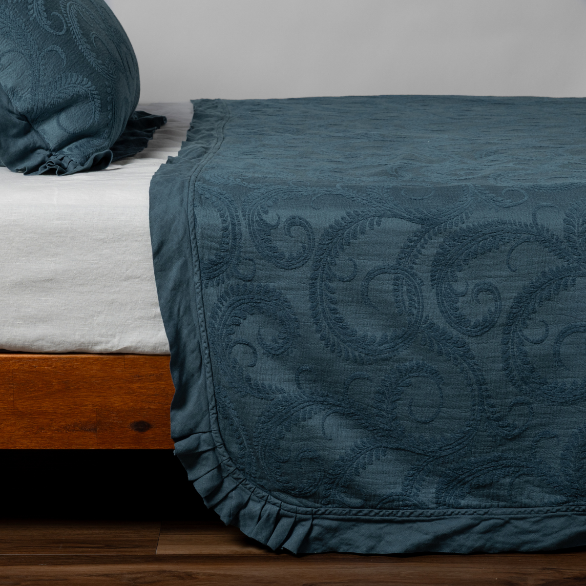 King-sized Bella Notte Marisette Bedspread in soft clouds fabric, showcased on a bed with a cozy, elegant look.